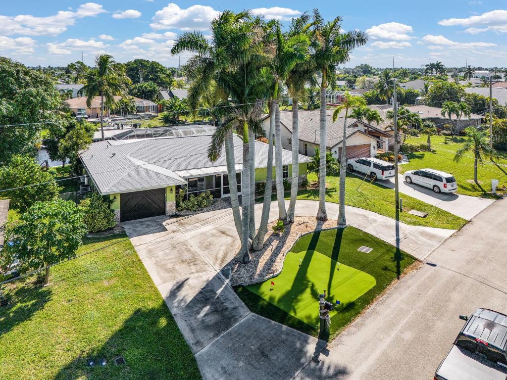 an aerial view of a house with palm trees at Coral Canal Cove in Cape Coral