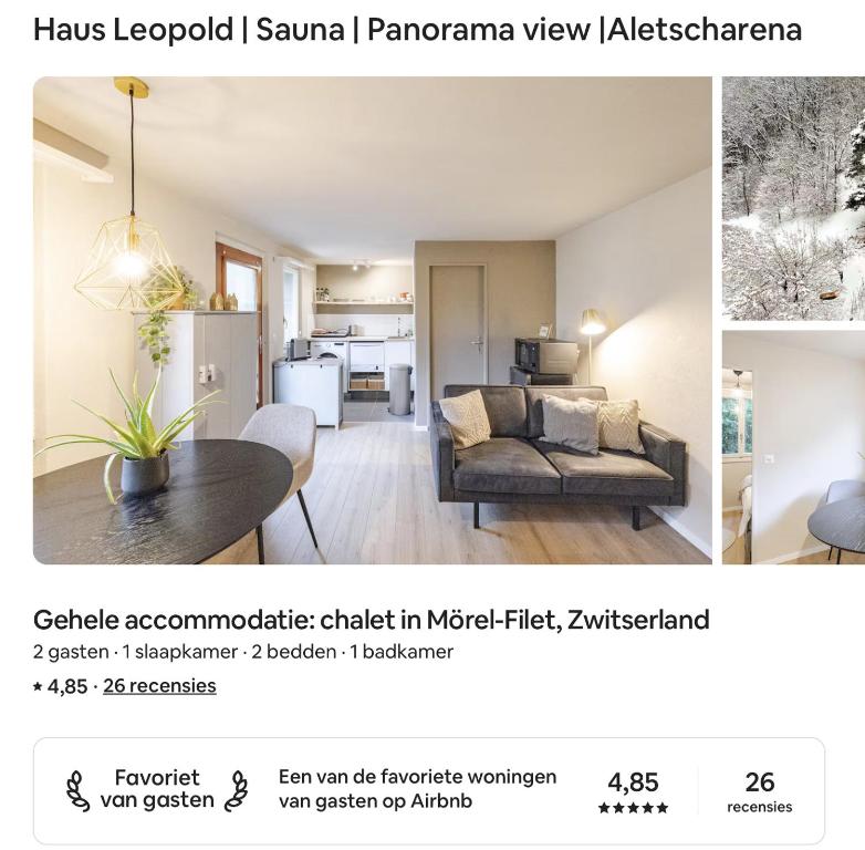a living room with a couch and a table in a room at Haus Leopold in Breiten