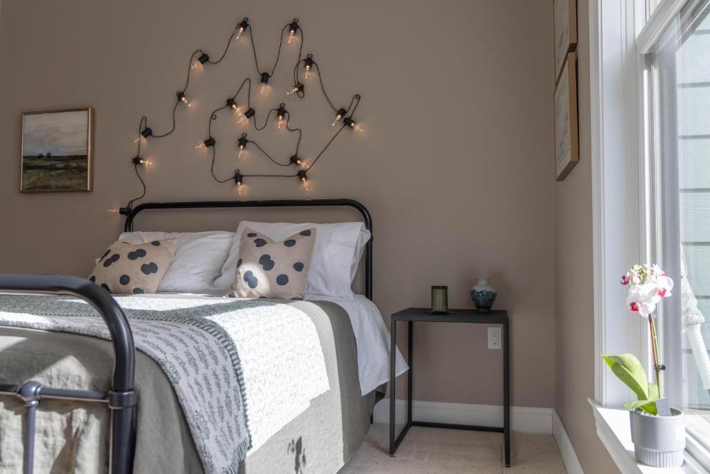 a bedroom with a bed with lights on it at An Locha B&B 