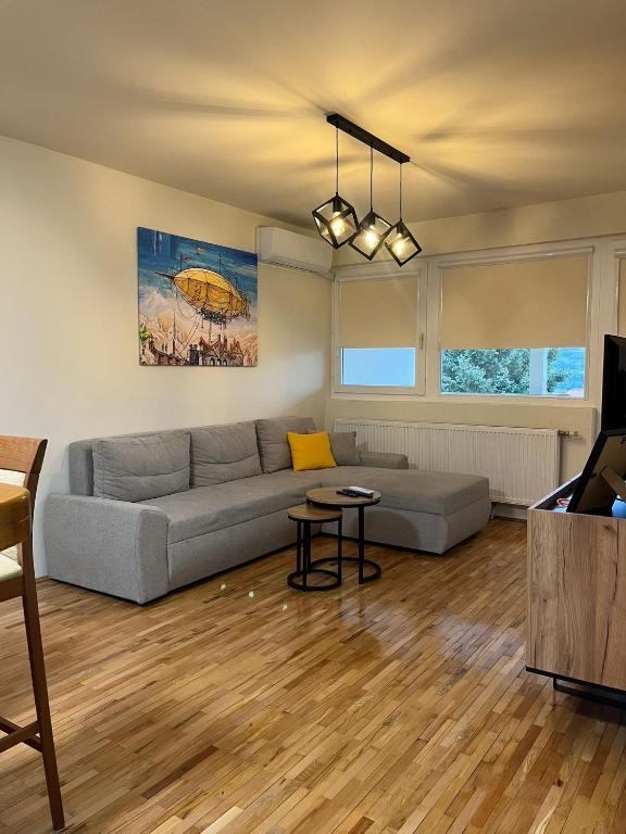 a living room with a couch and a tv at Stan na dan Kalin in Bugojno