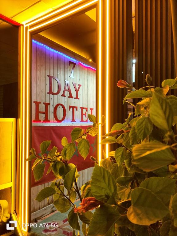 a window with a sign that says day hotel at HOTEL 7DAYS DAkHLA in Dakhla