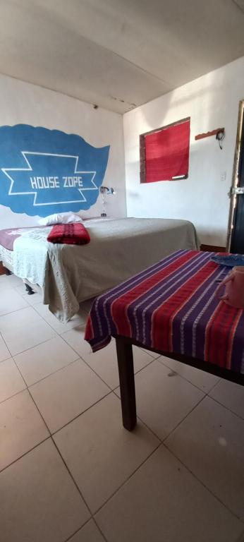 Postel nebo postele na pokoji v ubytování House Zope