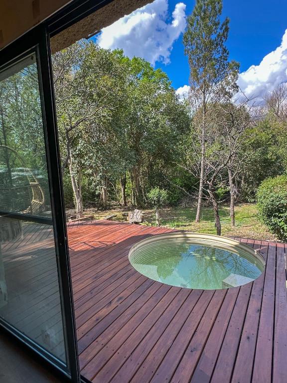 a view of a deck with a small pool at Casa de piedra con jardin y pileta - privada in Los Hornillos