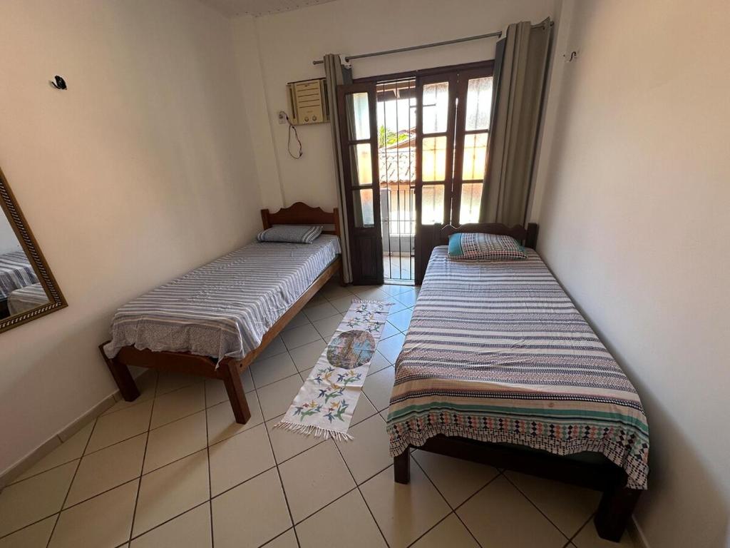 Cama o camas de una habitación en Apartamento Janelas do Atlântico Praia do Atalaia PA