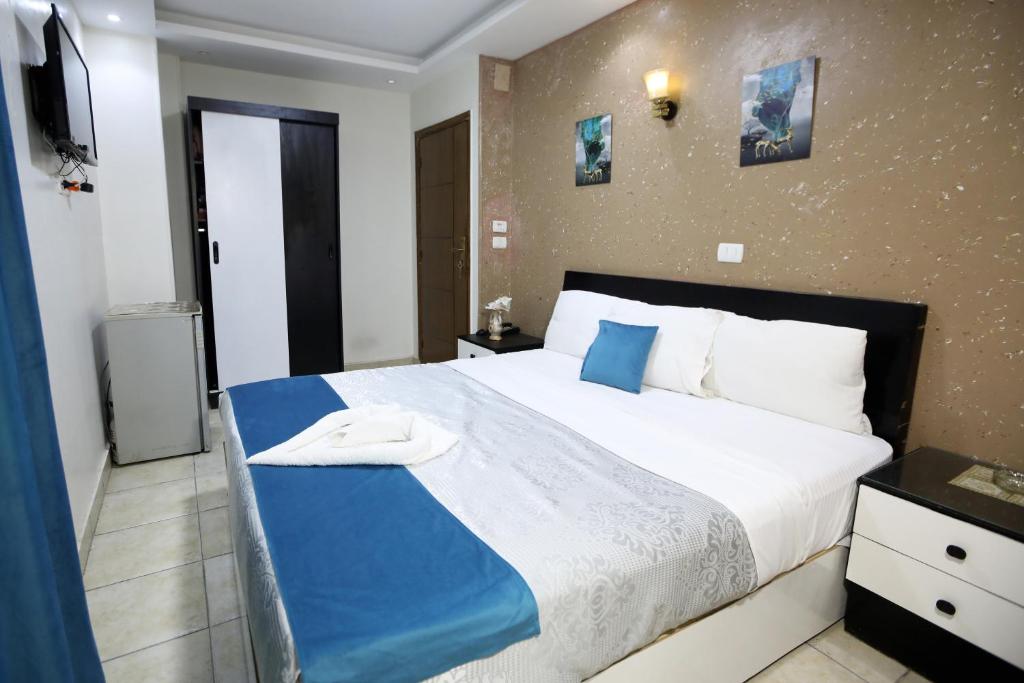 Postel nebo postele na pokoji v ubytování Osiris Hotel Downtown