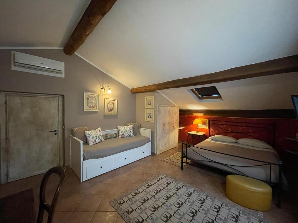 a bedroom with two beds in a room at B&B Le Stanze del Moro in Pállare
