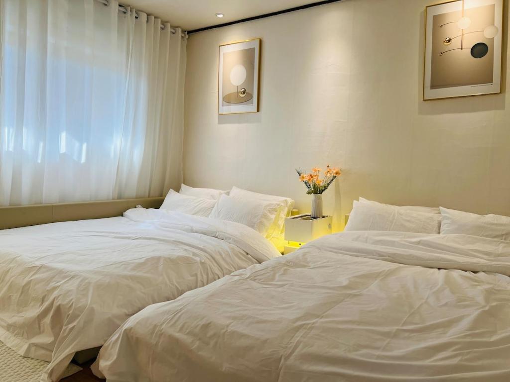 Postel nebo postele na pokoji v ubytování Only Yoo Stay