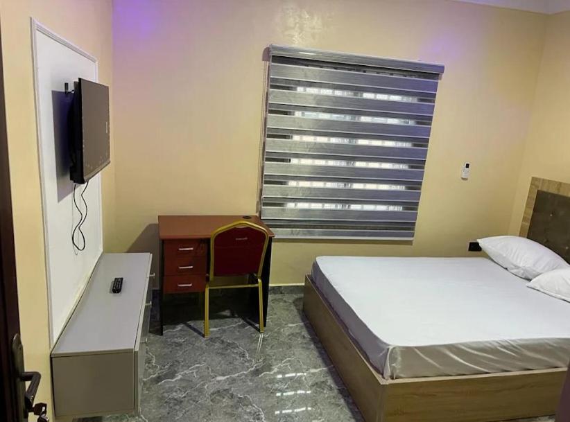 Postel nebo postele na pokoji v ubytování Roadmatch Hotel