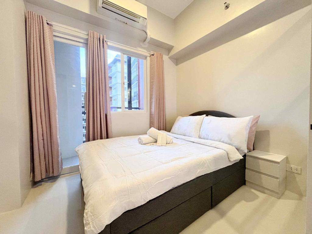 Postel nebo postele na pokoji v ubytování Greenthumbs Staycation