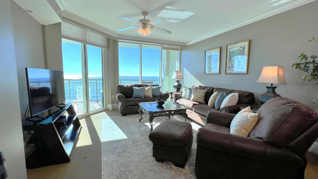 a living room with a couch and a tv at Mar Vista Grande - 806 in Myrtle Beach