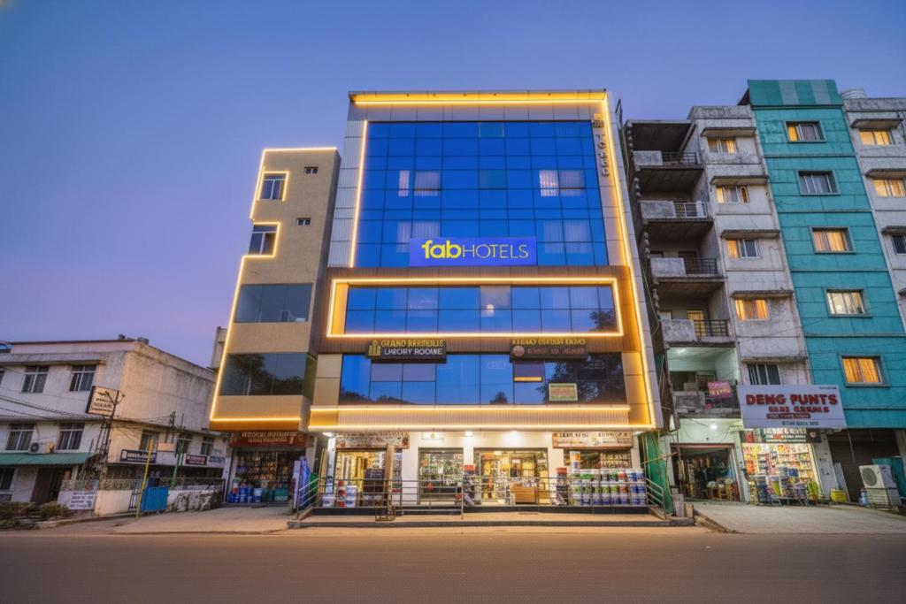 a building with a sign on the front of it at FabHotel Grand Broholic - Nr Hitech City in Hyderabad