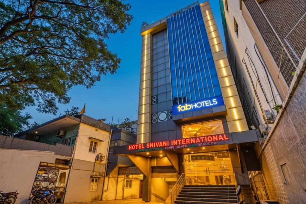 a building with a sign that reads yog sharma international at FabHotel Shivani International in Rānchī