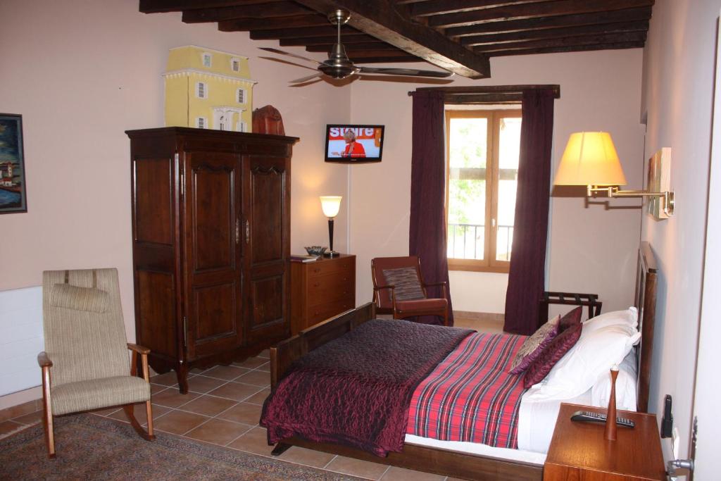 Postel nebo postele na pokoji v ubytování L'Ancienne Auberge