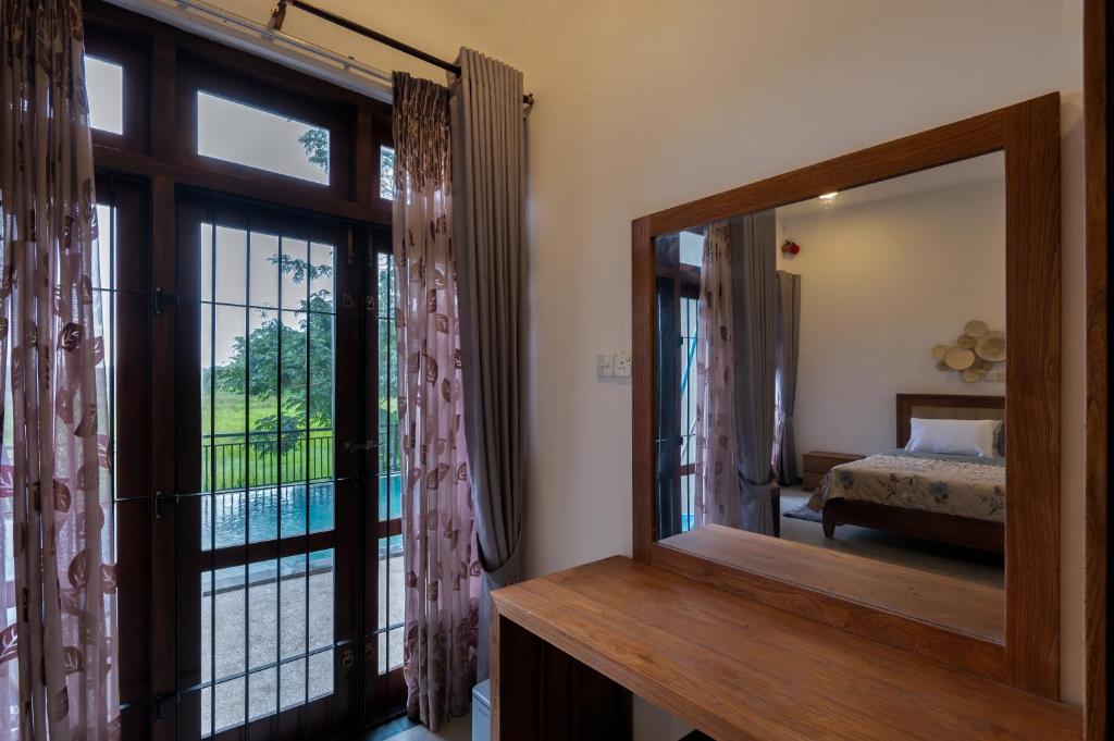 Ένα ή περισσότερα κρεβάτια σε δωμάτιο στο Sandila Villa