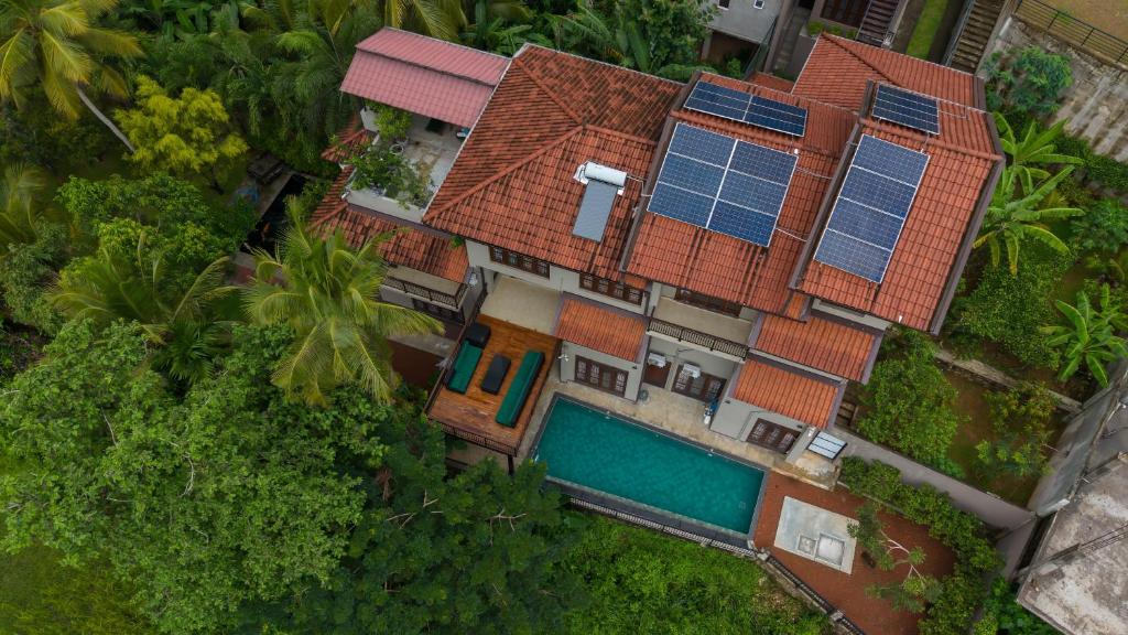 an aerial view of a house with solar panels on it at Sandila Villa in Matara