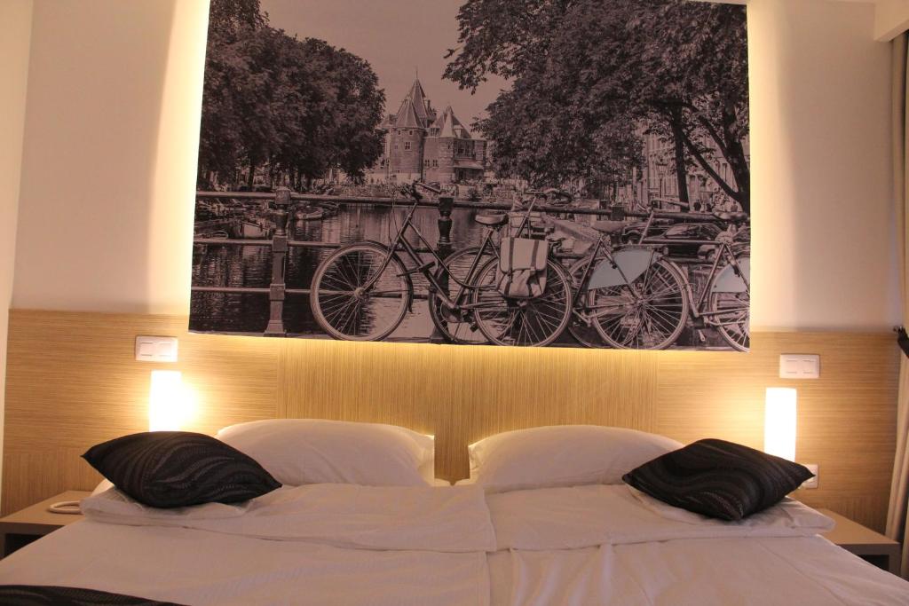 Postel nebo postele na pokoji v ubytování Hotel Grad
