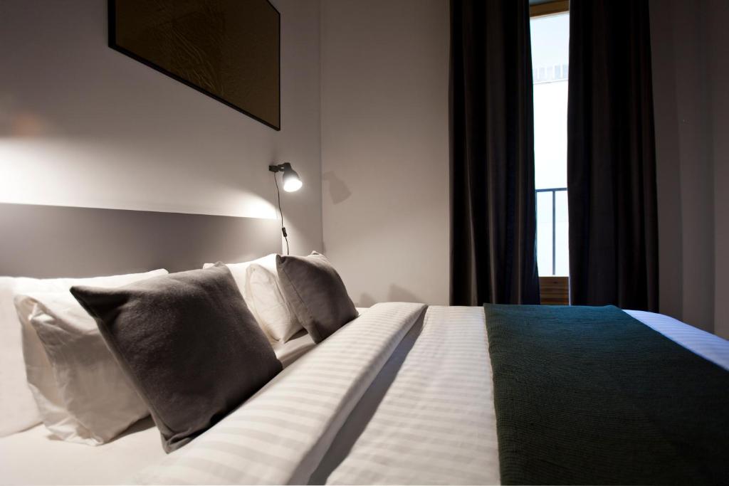 Posteľ alebo postele v izbe v ubytovaní Centric Gracia Apartments