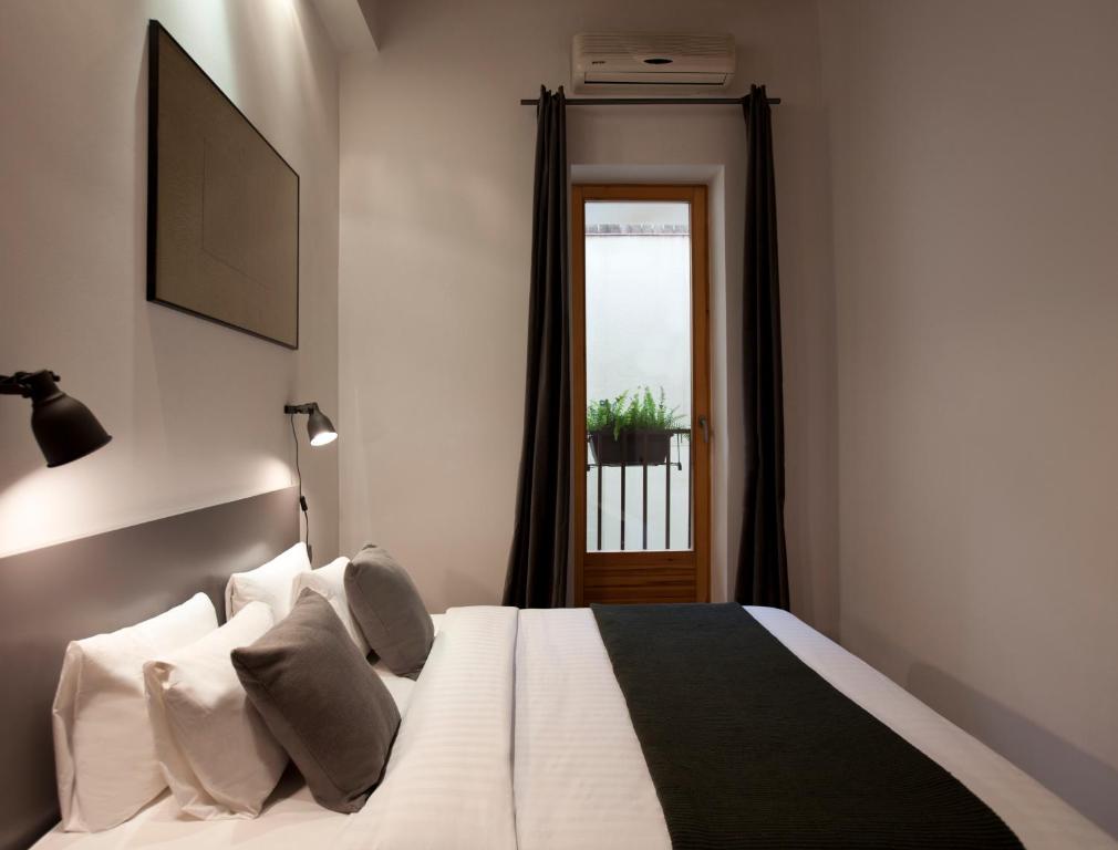 Televízia a/alebo spoločenská miestnosť v ubytovaní Centric Gracia Apartments