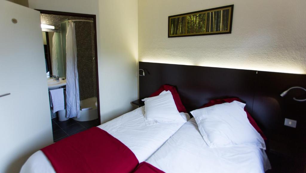 Postel nebo postele na pokoji v ubytování Hôtel Akena Creil - Clermont Agnetz