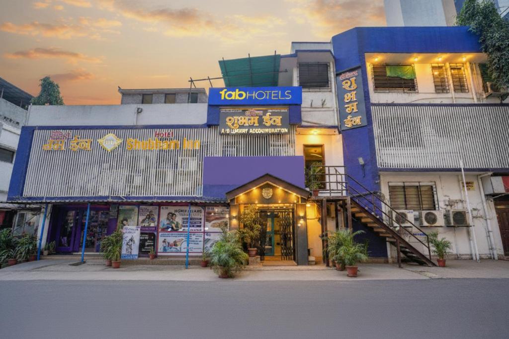 a blue building with a sign on it at FabHotel Shubham Inn - Nr Jain Mandir, Bhandup West in Mumbai