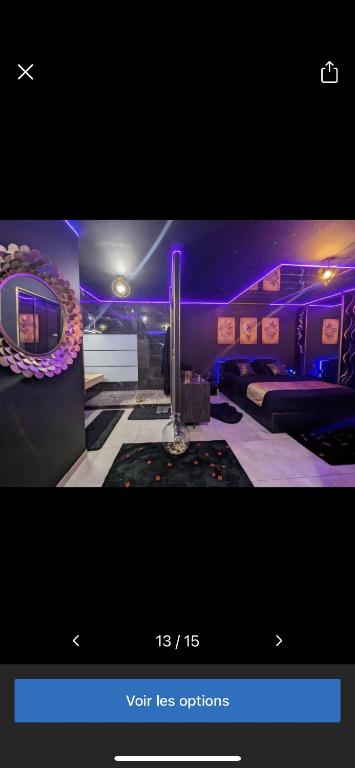 a picture of a room with purple lights at La Gold Room jacuzzi et sauna in Perpignan