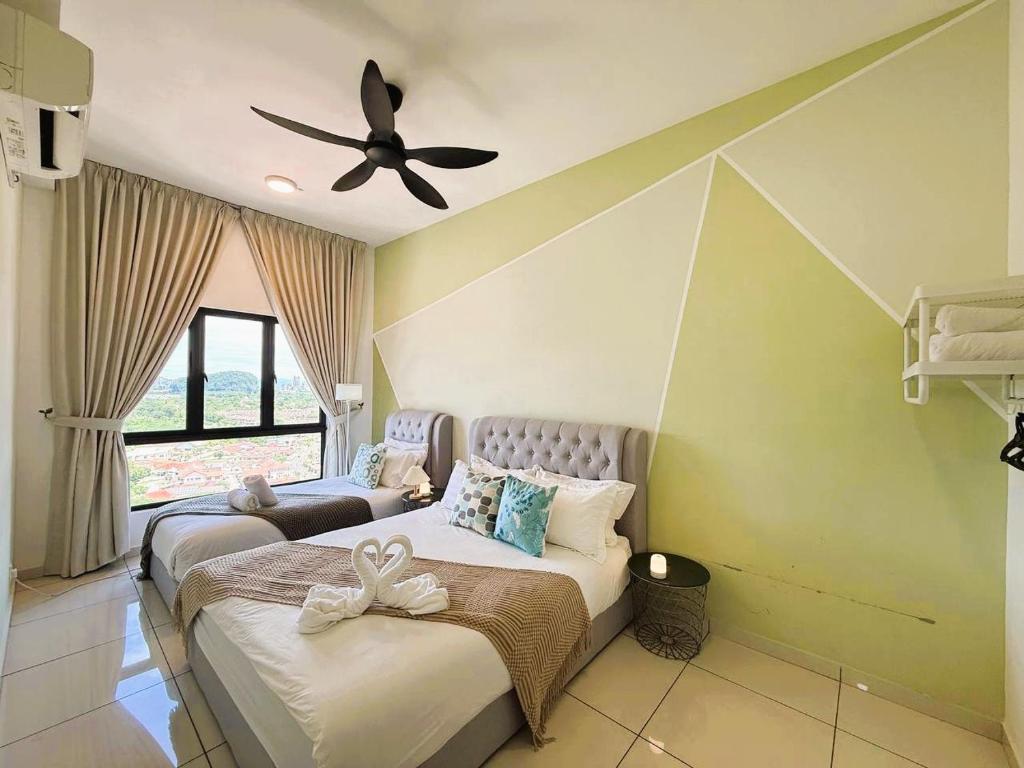 Ένα ή περισσότερα κρεβάτια σε δωμάτιο στο The Horizon Ipoh Emerald by Grab A Stay