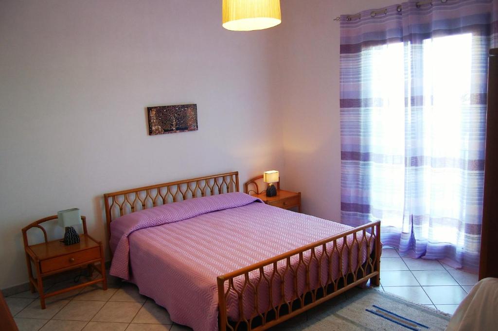 Postel nebo postele na pokoji v ubytování Hibiscus Rosso