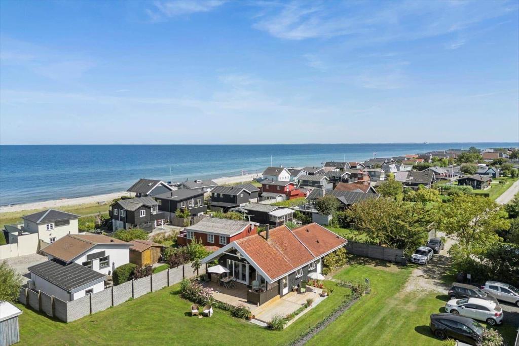 an aerial view of a residential neighborhood with the ocean at FY222-Otterup-Klovervaenget-13 in Otterup