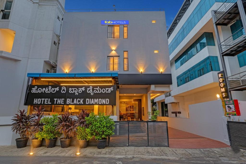 a building with a sign that reads hotel the black drupal at FabHotel The Black Diamond in Bengaluru