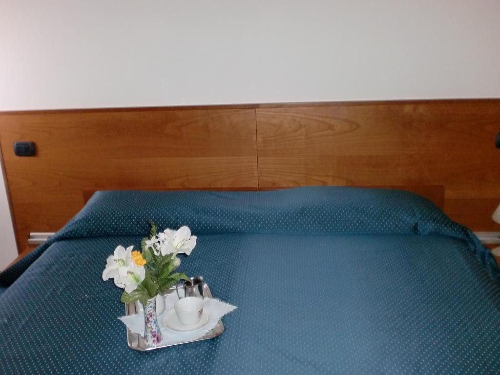 Postel nebo postele na pokoji v ubytování Rometta Hotel