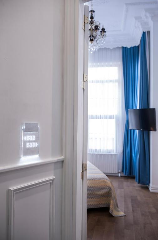 Postel nebo postele na pokoji v ubytování Rodosto Hotel