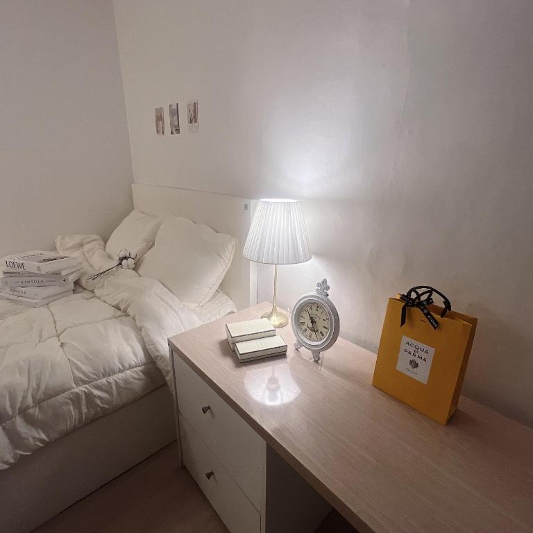 Ένα ή περισσότερα κρεβάτια σε δωμάτιο στο 코튼스테이 Cottonstay