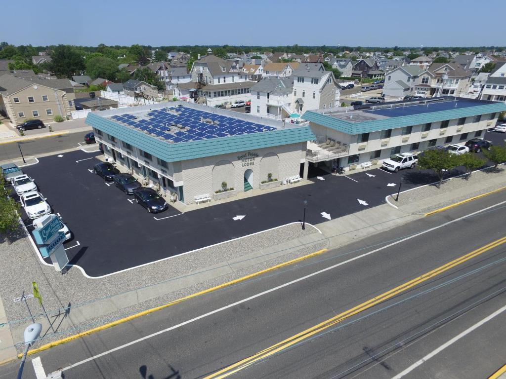 an overhead view of a building with solar panels on its roof at Sand Pebble Motor Lodge in Point Pleasant Beach