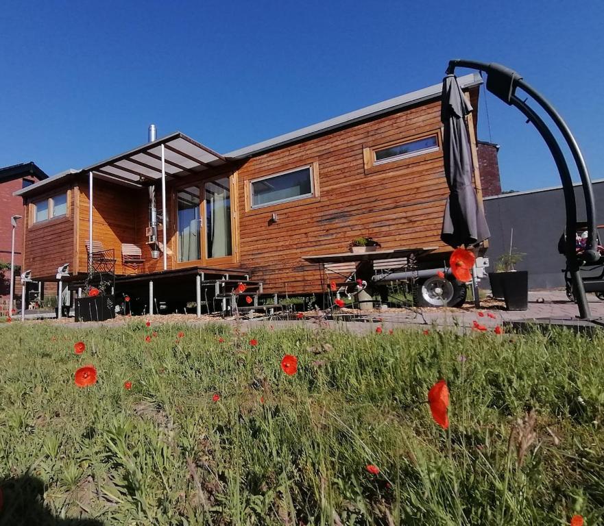 a house is being built in a field of flowers at Tiny house with view of nature in Coesfeld