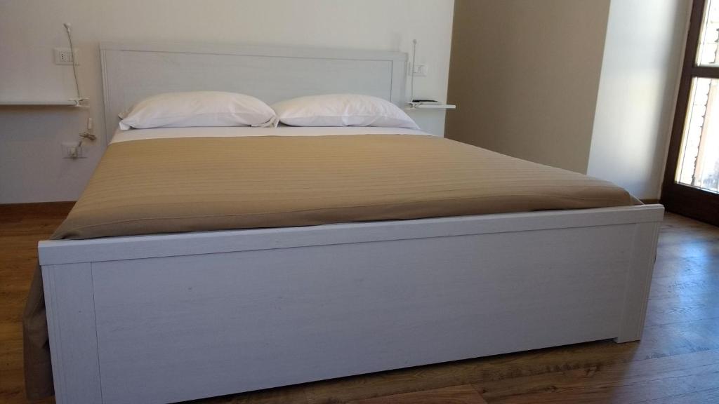 Postel nebo postele na pokoji v ubytování Camere Calocci