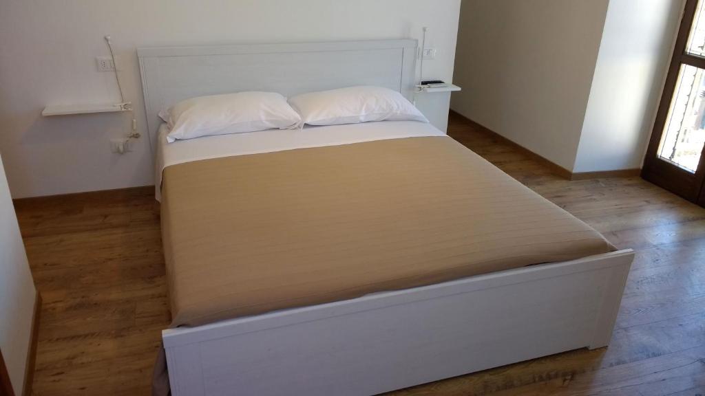 Postel nebo postele na pokoji v ubytování Camere Calocci