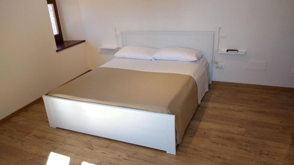 Postel nebo postele na pokoji v ubytování Camere Calocci