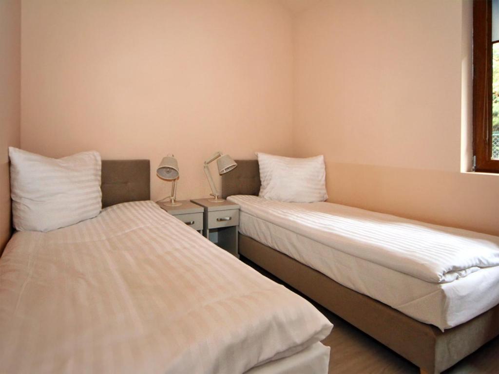 Postel nebo postele na pokoji v ubytování Powroty. Domy Gościnne "Ibis"