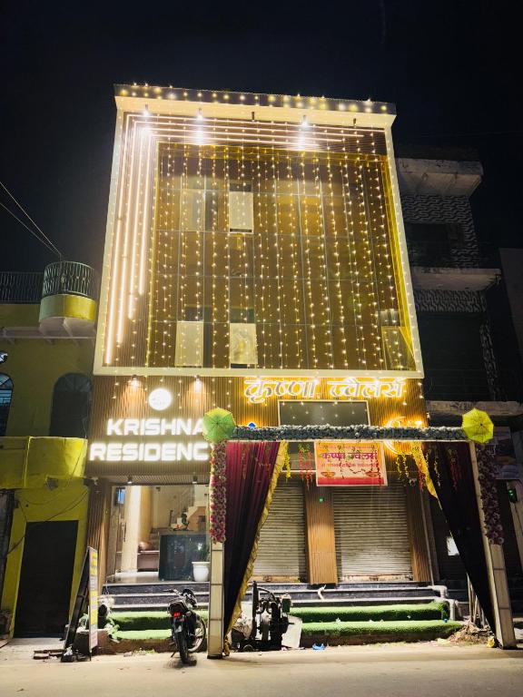 a large building with lights on top of it at krishna residency in Mathura
