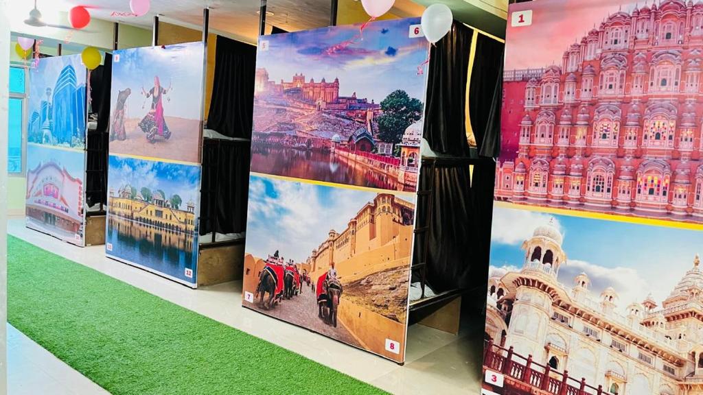 a group of posters on display in a store at REST POINT Dormitory in Jaipur
