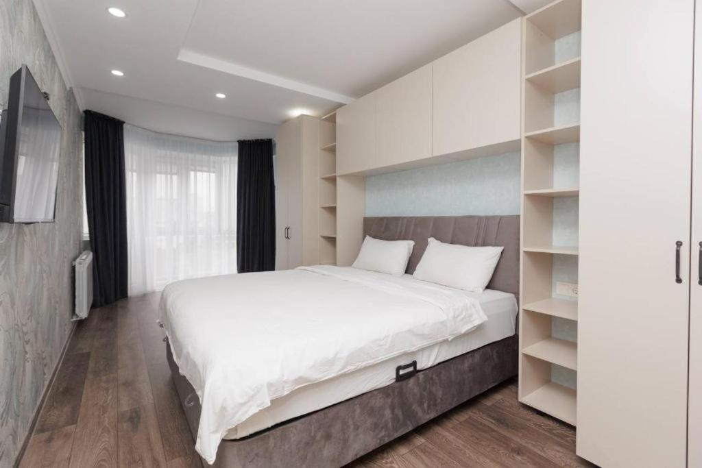 Ένα ή περισσότερα κρεβάτια σε δωμάτιο στο Apartament Premium din Centrul Chișinăului