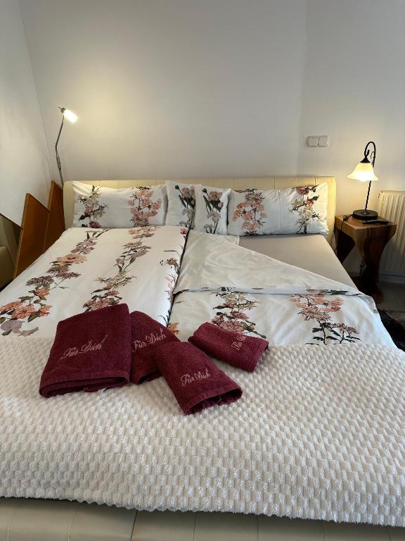 a large bed with two pillows on it at Komfortzimmer in Trieben