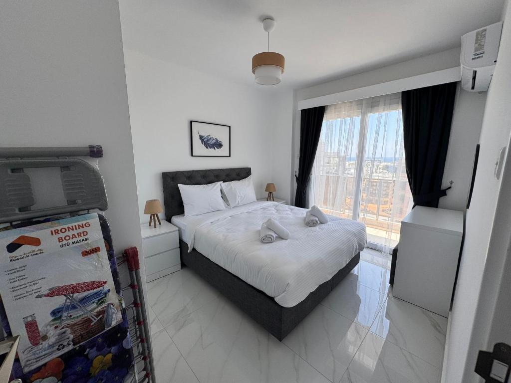 a bedroom with a bed with two stuffed animals on it at İsmail Yılmaz Hotel in Trabzon