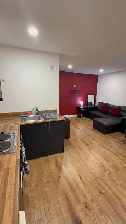 a large living room with a couch and a table at City centre studio in Hull