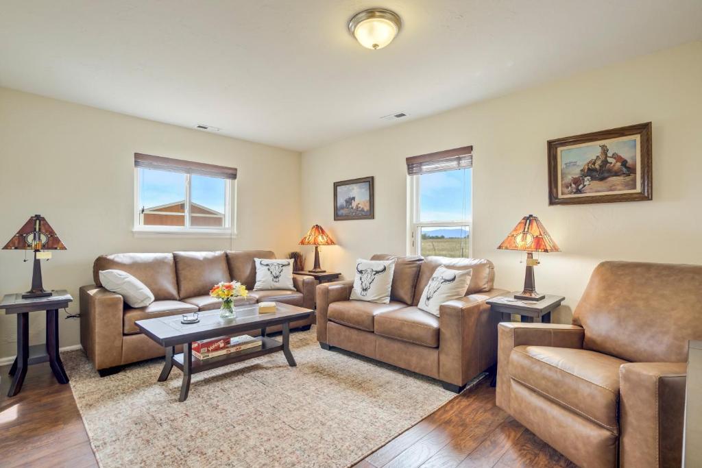 a living room with two couches and a table at 10457 Elbert in Peyton