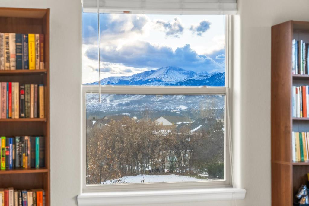 a window with a view of a snowy mountain at 1144 Equinox in Colorado Springs