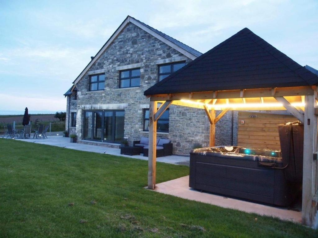 a gazebo in the backyard of a house at 5 Bed in Hay-on-Wye 78163 in Painscastle