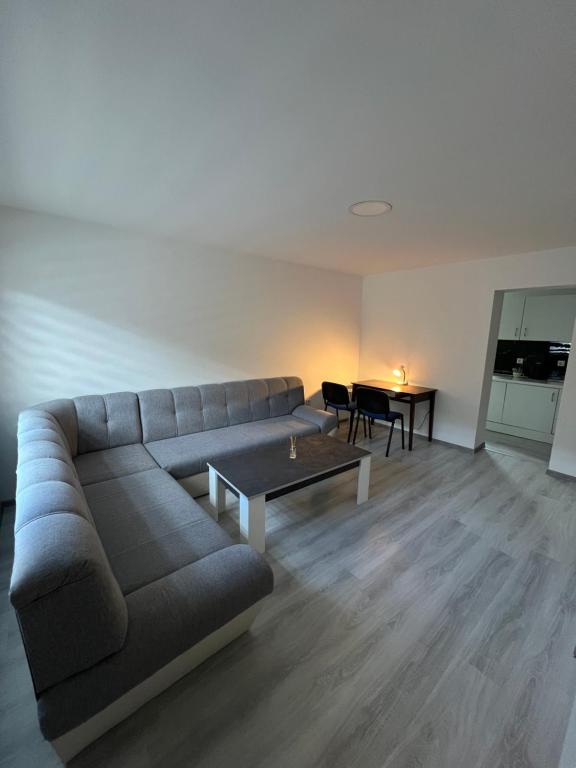a living room with a couch and a table at Apartment Lana Vareš in Vareš