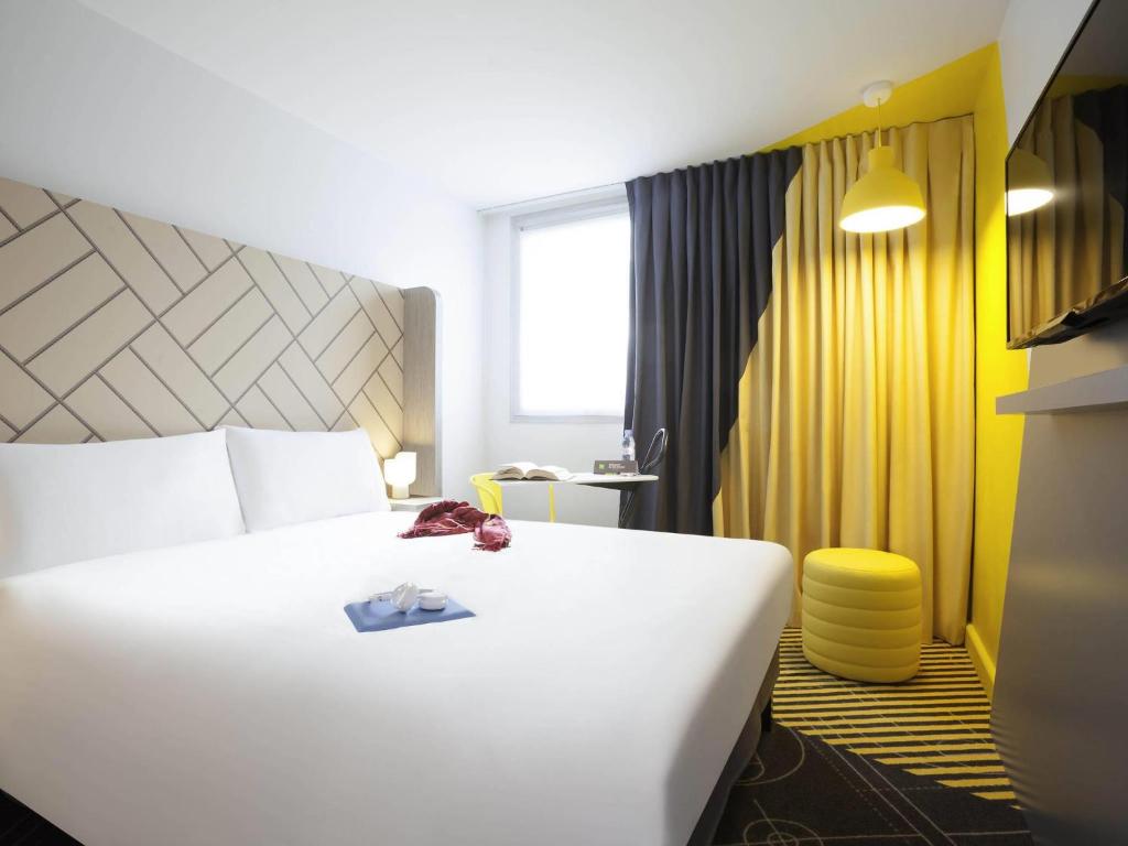 Postel nebo postele na pokoji v ubytování Ibis Styles Paris Massena Olympiades