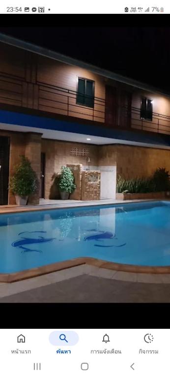 a picture of a swimming pool at night at Hua hin pool view in Hua Hin